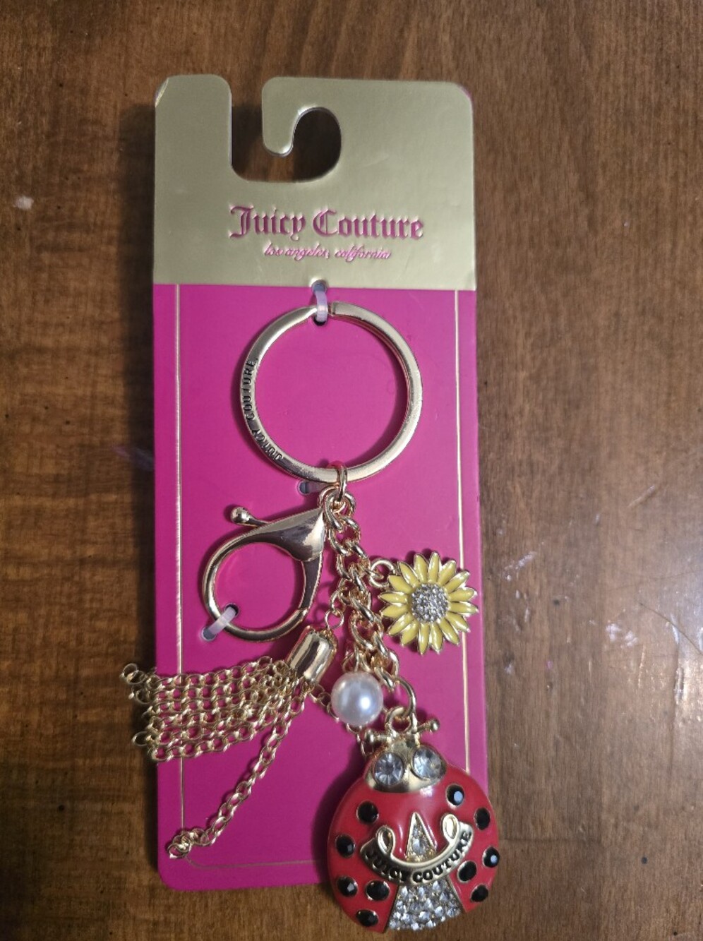 Juicy Couture Gold-Tone Keyring with Red Ladybug, Yellow Sunflower & Pearl
